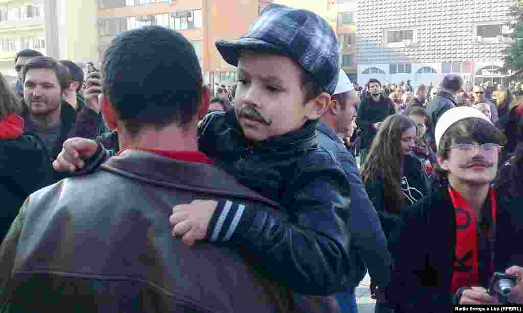 A young participant in the "Mustache Men" celebration