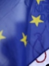A poster depicting Russian President Vladimir Putin is seen behind an EU flag during a rally by the Czech Republic's Ukrainian community following Russia's invasion of Crimea, in Prague in 2014.