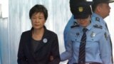 SOUTH KOREA -- In this Oct. 10, 2017, file photo, former South Korean President Park Geun-hye, left, arrives to attend a hearing on the extension of her detention at the Seoul Central District Court in Seoul, South Korea.