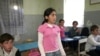 Children attend class at a high school in the Shashikvara village, close to Gali