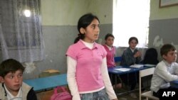 Children attend class at a high school in the Shashikvara village, close to Gali