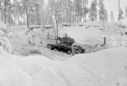 A Red Army tank rolls in Finland. The underequipped Finns initially struggled to counter the Soviets' armored columns.