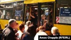 Crammed buses with signs reading "FREE of charge" continue to ferry commuters throughout Tbilisi on June 5.