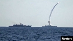 A missile is fired from a Russian warship in the Mediterranean Sea on June 22.