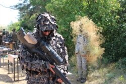 Ukrainian snipers take part in exercises at a training ground near Druzhkivka in July 2018.