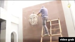 Iraq - screen grab from a video reported to be Islamic State militants destroying ancient artifacts in Mosul.