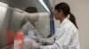 Dr. Sonia Macieiewski samples proteins at Novavax labs in Rockville, Maryland on March 20, 2020, one of the labs developing a vaccine for the coronavirus, COVID-19. (Photo by ANDREW CABALLERO-REYNOLDS / AFP)
