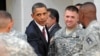U.S. President Barack Obama shakes hands with Iraq war veterans at Fort Bliss, Texas, last year.