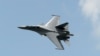 Singapore -- A Sukhoi SU-30 fighter jet from the Royal Malaysian Air Force performs a slow fly past during the Singapore Airshow at Changi exhibition center in Singapore, February 16, 2016