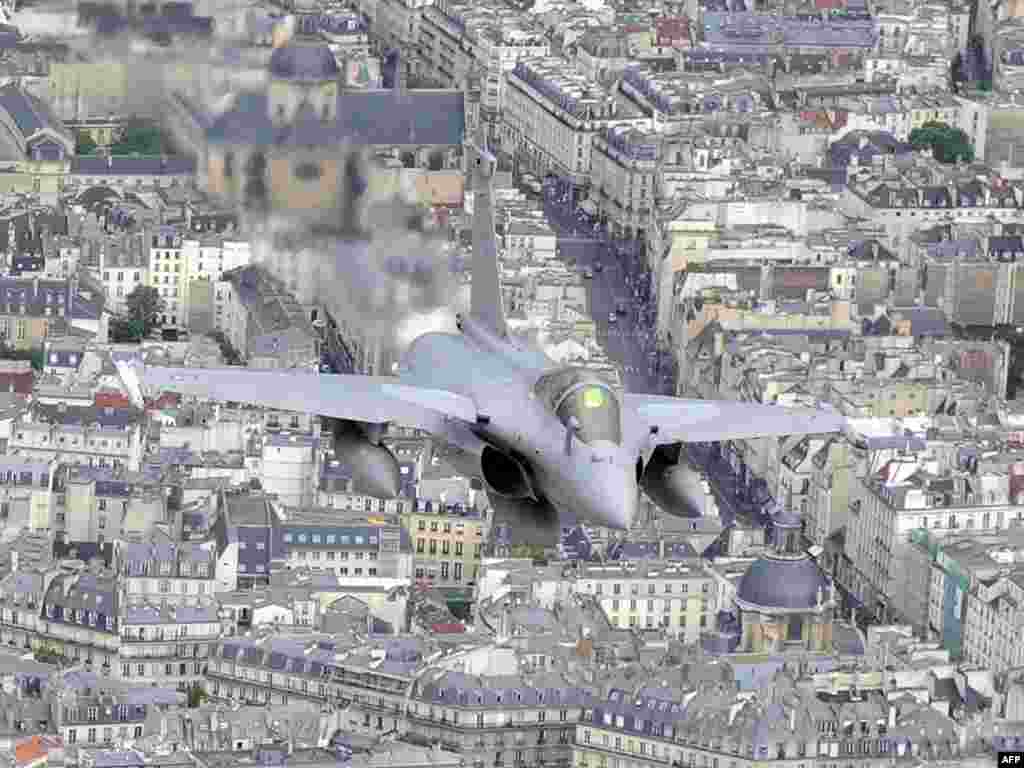 French "Rafale" jets fly over Paris during the Bastille Day annual military parade on July 14. Photo by Boris Horvat for AFP