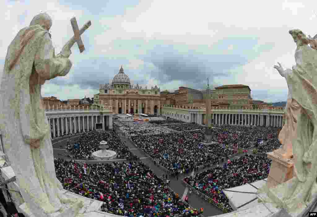 A huge crowd gathered on St. Peter&#39;s Square in the Vatican for the historic dual canonization of Roman Catholic Popes John XXIII and John Paul II. (AFP/Vincenzo Pinto)