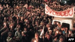 Czechoslovakia/Czech Republic - Thousands of people gather under a banner reading "Liberty" flashing Victory signs as they stage the biggest anti-Communist rally for 20 years, Prague, 27Nov2009