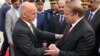 Pakistan Prime Minister Nawaz Sharif, right, greets Afghan President Ashraf Ghani upon his arrival at the military Nur Khan airbase in Rawalpindi on December 9.