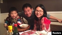 Xiyue Wang, a naturalized American citizen from China, arrested in Iran last August while researching Persian history for his doctoral thesis at Princeton University, is shown with his wife and son in this family photo, undated