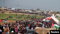 Израил менен Газа секторунун чек арасына чогулган палестиндер. 30-март, 2018-жыл.