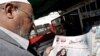 A man looks at the preliminary election results in Baghdad.