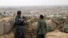Afghan police keep watch on the outskirts of Kunduz. (file photo)