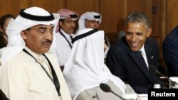 U.S. President Barack Obama talks with the emir of Kuwait , Sheikh Sabah Al-Ahmad Al-Jaber Al-Sabah, as he hosts a summit at Camp David in Maryland on May 14.