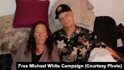U.S. citizen Michael White, pictured here with his mother, Joanne, had been detained in Iran since 2018.