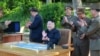 Лидер Северной Кореи Ким Чен Ын наблюдает за запуском баллистической ракеты