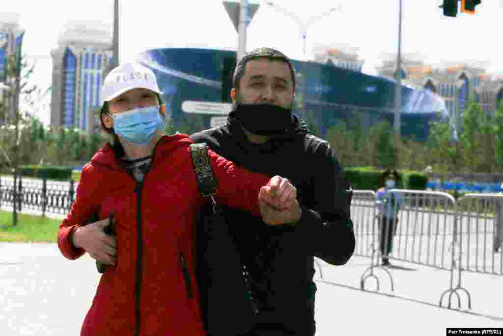 Police take away a would-be demonstrator in Nur-Sultan.