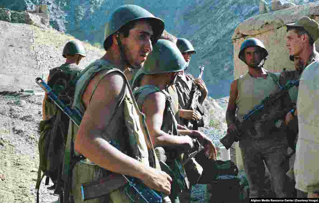 Soviet soldiers on patrol. Accusations of atrocities during the war further tarnished the Soviet Union's image. After catching Afghan children torturing wounded comrades, one soldier admitted rounding up several women and children, pouring kerosene on them, and burning them alive.