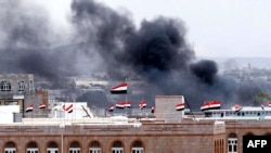 Black smoke ascends in the vicinity of the Interior Ministry Building in the Yemeni capital, Sanaa