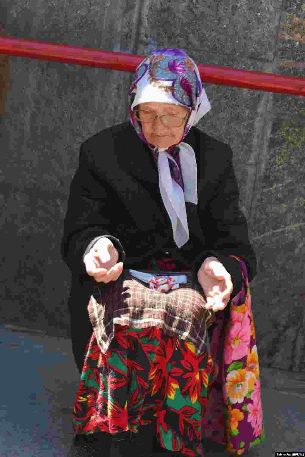 A woman begs in Almaty, Kazakhstan. July 21, 2014.
