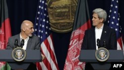 Afghanistan President Ashraf Ghani (L) and U.S. Secretary of State John Kerry hold a news conference after a day of talks at Camp David on March 23.