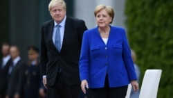 Немис канцлери Ангела Меркел менен британ премьер-министри Борис Жонсон.