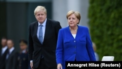 Premijer Velike Britanije Boris Johnson i kancelarka Njemačke Angela Merkel