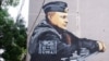 Граффити «телеграм-партии» «Суверенный Крым» на мурале с изображением президента России Владимира Путина в Симферополе