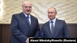 Russian President Vladimir Putin greets Belarusian President Alyaksandr Lukashenka in Sochi on August 22. 