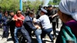 Kazakhstan -- Riot police officers detain demonstrators during a protest against President's government and the land reform it has proposed, in Almaty, May 21, 2016