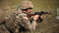 Armenia -- An Armenian soldier shoots a Kalashnikov rifle during a military exercise in Vayots Dzor province, April 16, 2020.