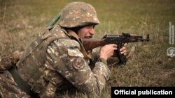 An Armenian soldier takes part in a military exercise in Armenia's Vayots Dzor Province on April 16. (file photo)