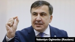 Mikheil Saakashvili addresses the media inside a court building in Kyiv on January 3.