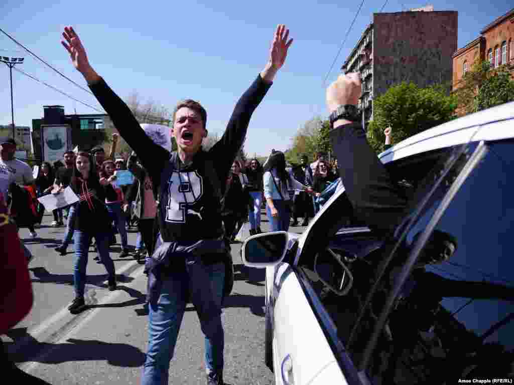 Students took the day off classes to protest. Two traffic police cars, with smiling drivers, beeped their support.