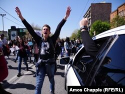 A driver gestures in support of protesting students in Yervan on the morning of April 23.