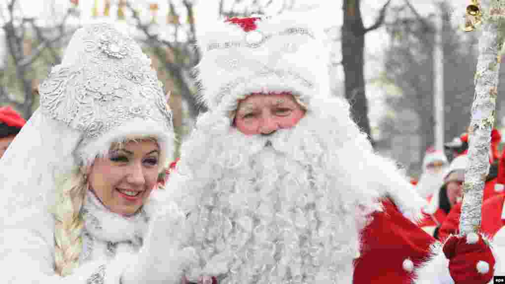 Father Frost and his granddaughter take part in a New Year&#39;s parade in the Kyrgyz capital, Bishkek. (epa/Igor Kovalenko)
