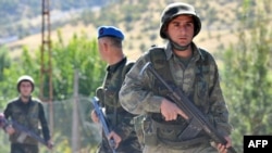 Turkish soldiers patrol on a road near the village of Uludere in the southeastern province of Sirnak, 15 kilometers from the Turkish-Iraqi border, in October.