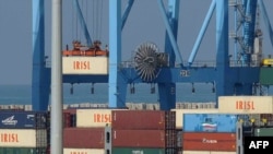 The logo of the Islamic Republic of Iran Shipping Lines mark containers being lifted from a ship in the Israeli port of Ashdod in November 2009.