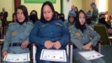 Afghan policewomen receive certificates for completing a counternarcotics training course in Kabul under the old administration before the Taliban takeover. (file photo)