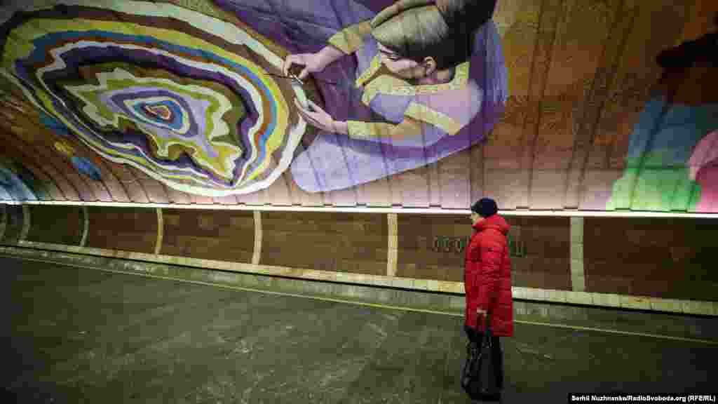 Ukrainian artist Oleksandr Britsets portrayed a girl weaving a rug into the shape of his country. 