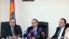 Armenia - Newly appointed Justice Minister Hovannes Manukian (L) is introduced to his staff by Prime Minister Hovik Abrahamian (C) in the presence of his predecessor Hrayr Tovmasian, Yerevan, 5Mar2014. 