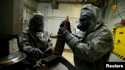 The Organization for the Prohibition of Chemical Weapons, the international group overseeing the removal and destruction of Syria's chemical arsenal, says that less than 5 percent of the chemicals declared by Syria have been removed so far. (file photo)