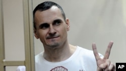 Oleh Sentsov gestures at a court in Rostov-on-Don in August 2015.