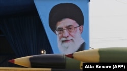  An Iranian military truck carries surface-to-air missiles past a portrait of Iran's Supreme Leader Ayatollah Ali Khamenei during a parade on the occasion of the country's annual army day in Tehran, April 18, 2018