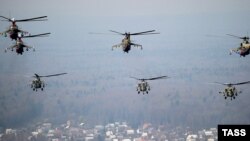 Russia -- Mi-8 helicopters fly over the Air Force's Kubinka Airfield west of Moscow, 16Apr2010