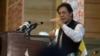 Pakistani Prime Minister Imran Khan addresses the legislative assembly in Muzaffarabad on August 14.
